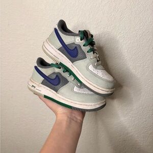 Nike Low Top Sneakers in Sage Green with Blue Swoosh